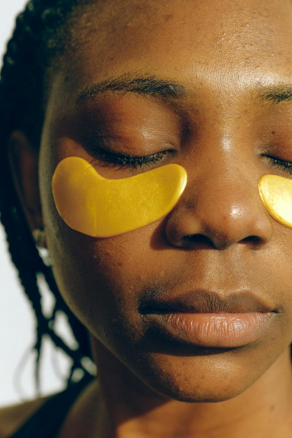 closeup shot of a woman with under eye patches