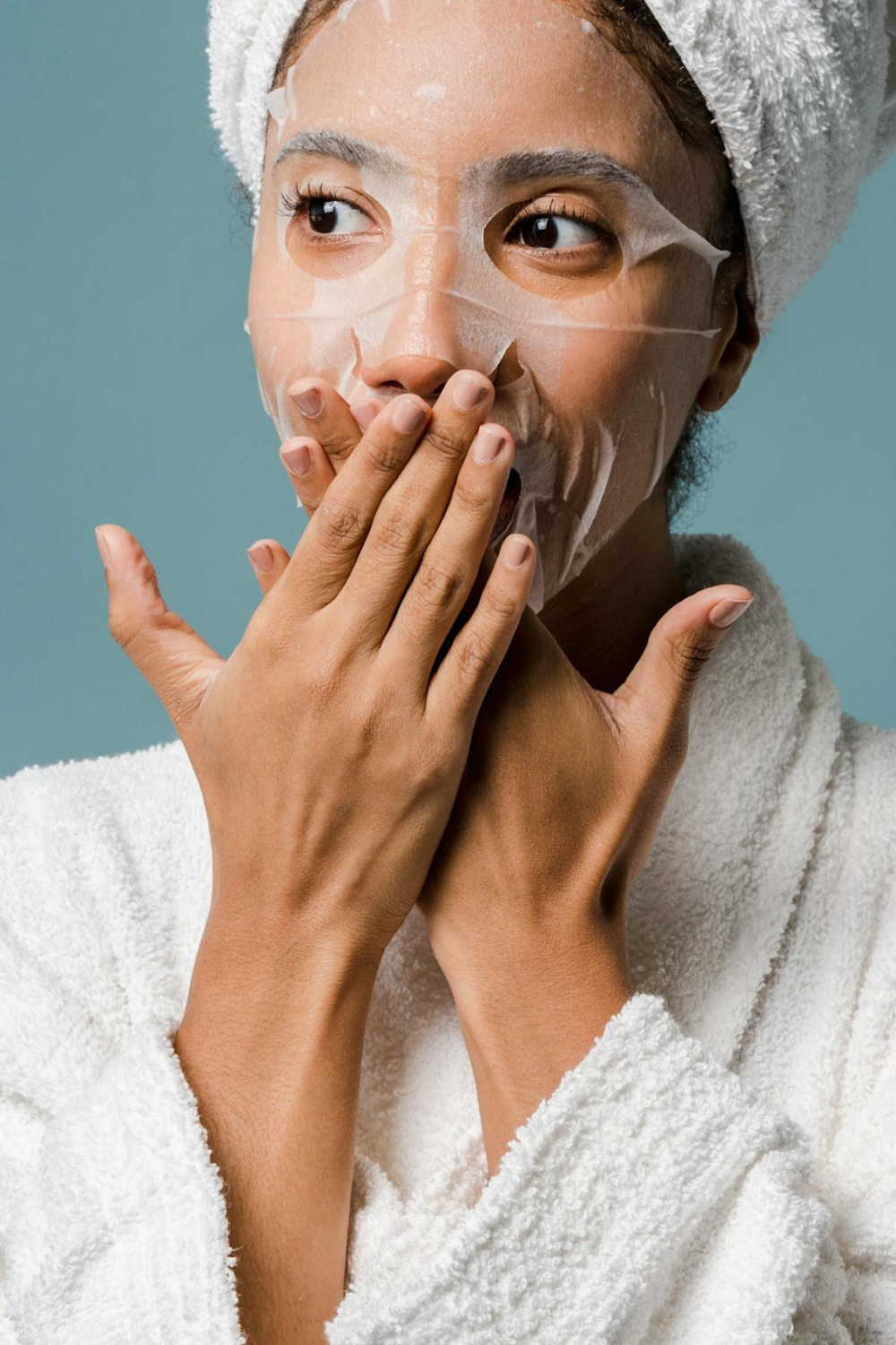 a woman with surprised look with a face mask on