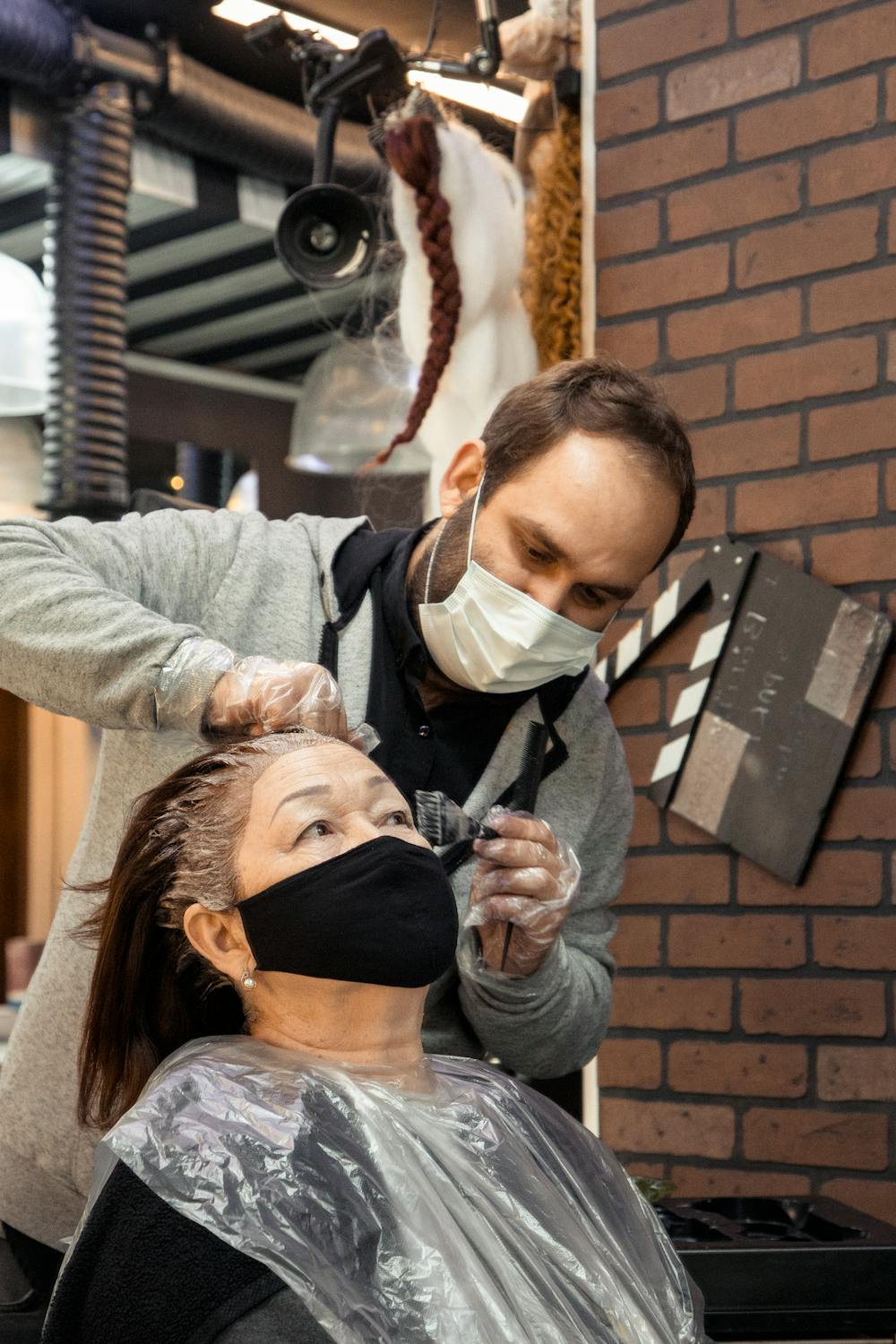 a woman at a salon getting her hair colored