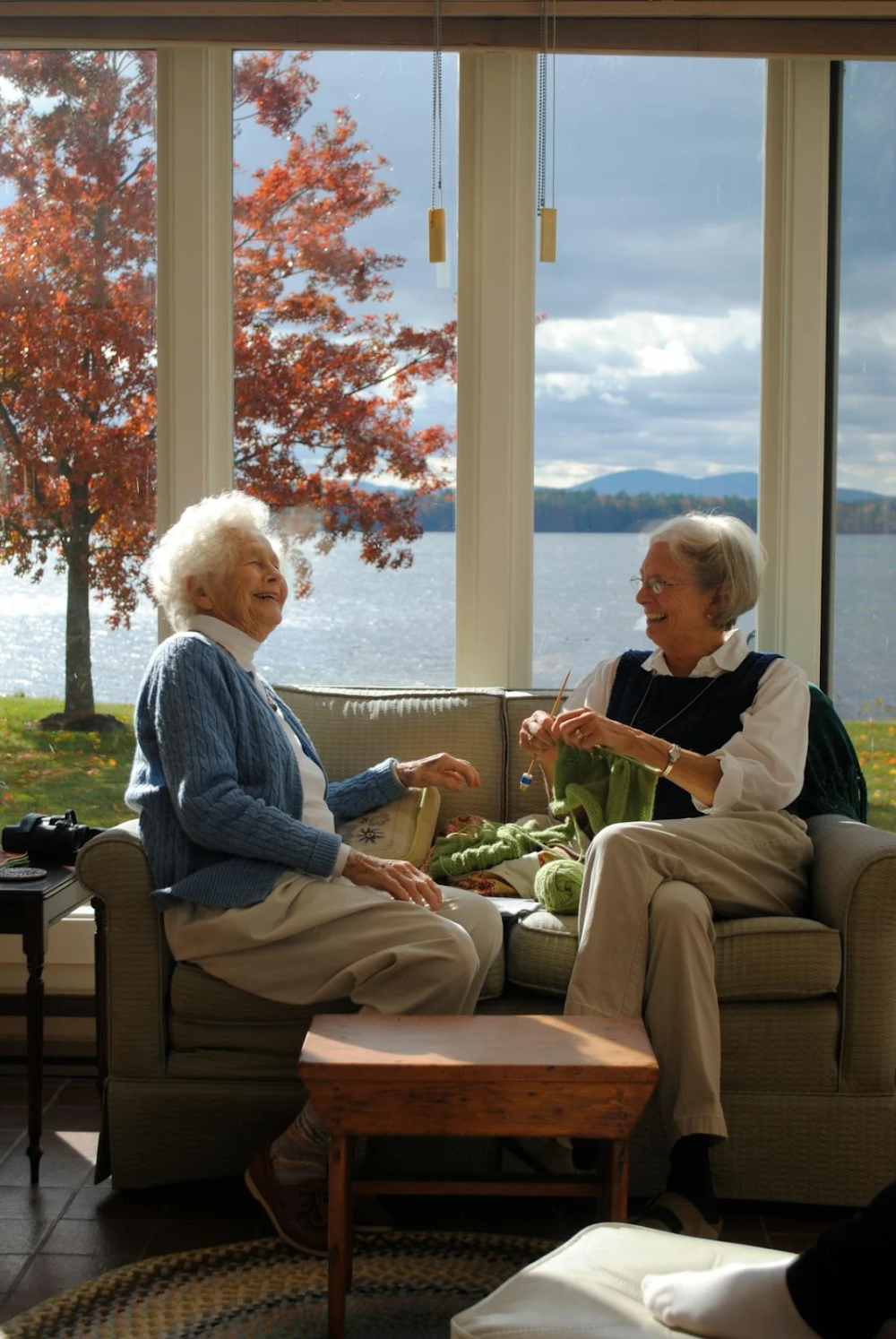 two elder woman discussing something